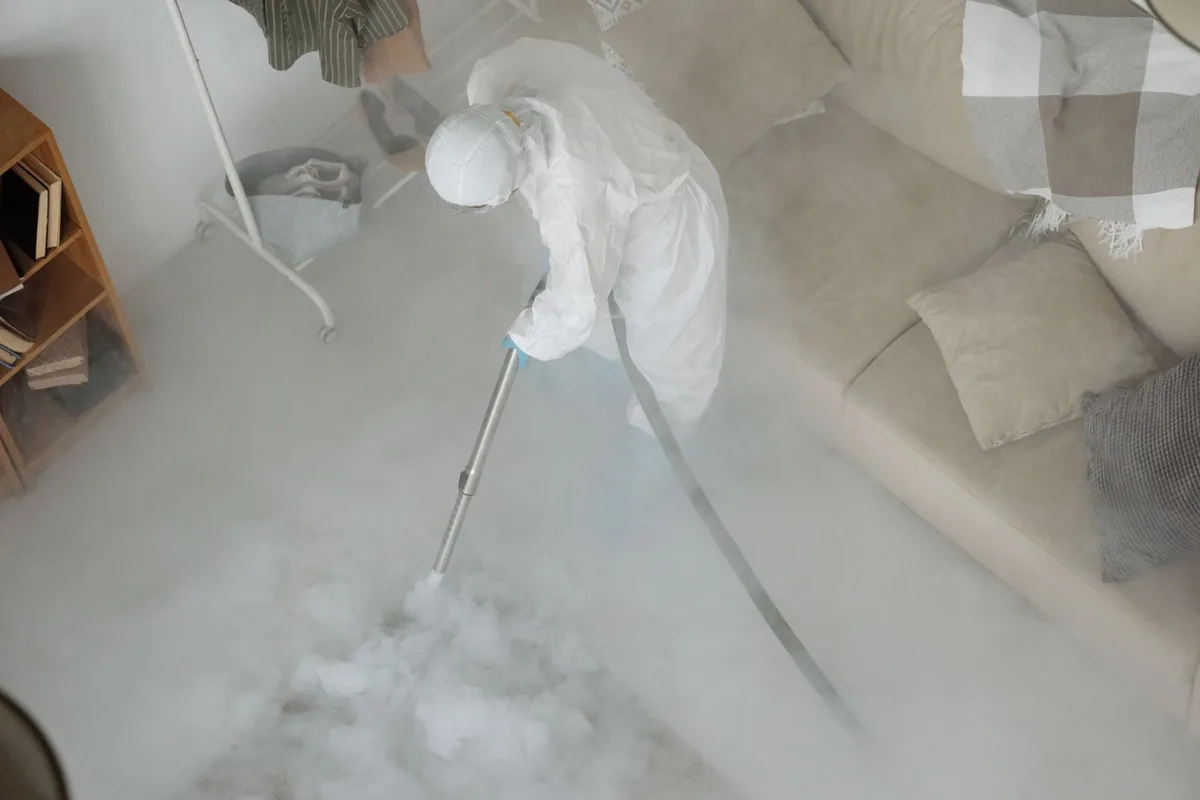 Biohazard cleanup technician in protective equipment, Nemacolin, PA